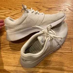 Well worn Nike white sneakers